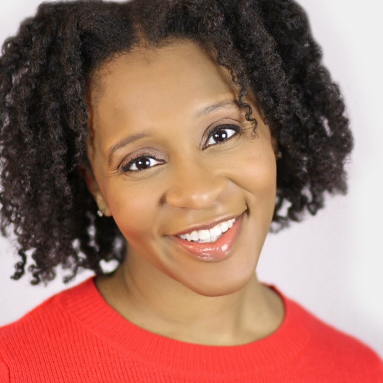 A woman with curly hair and a red shirt.