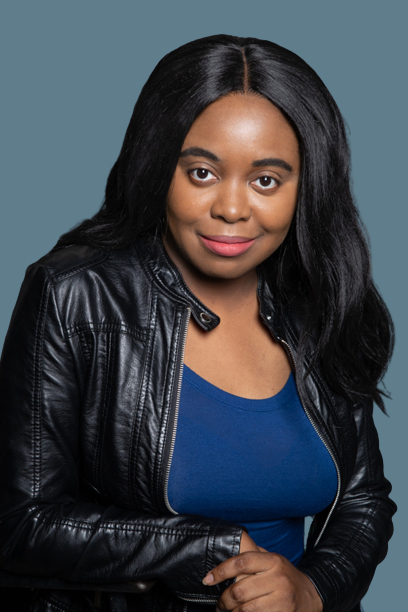 A woman in a black jacket and blue shirt