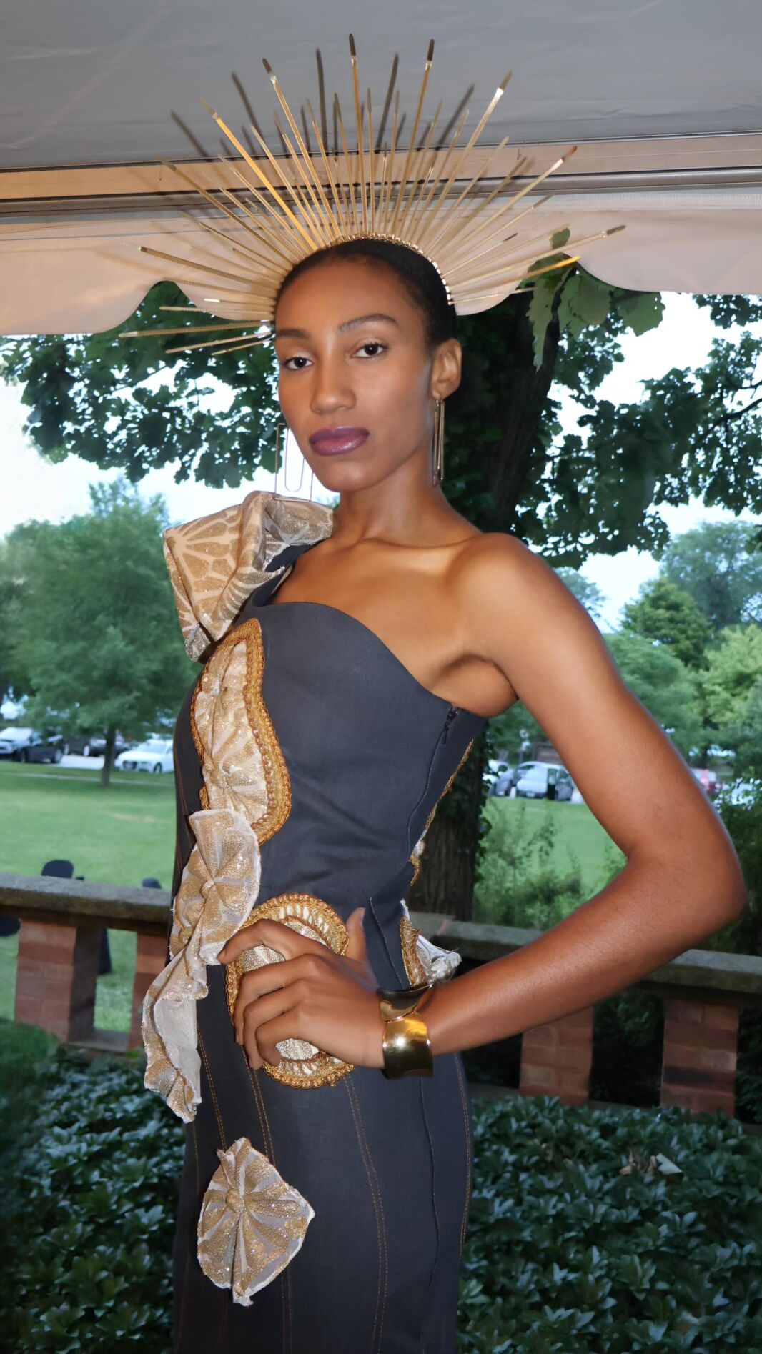 A woman in an elegant dress posing for the camera.